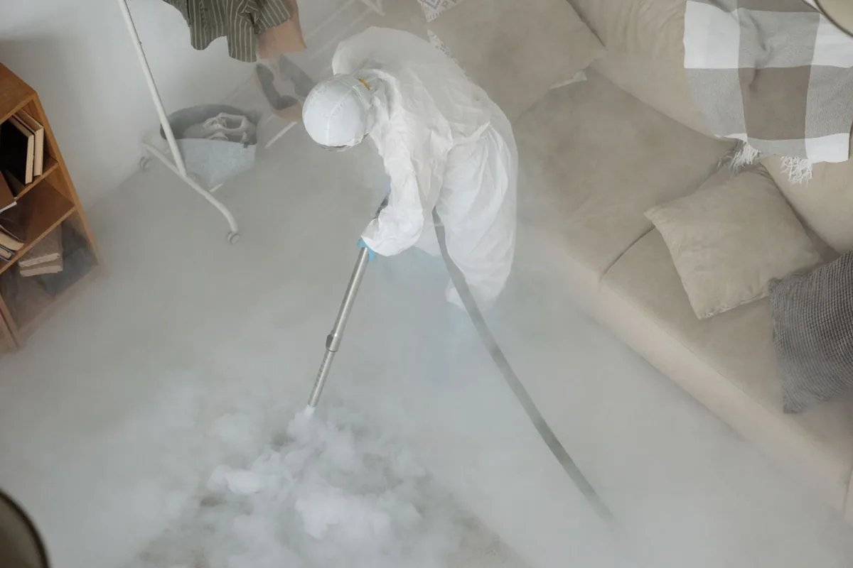 Biohazard cleanup technician in protective equipment, Beavercreek, OR